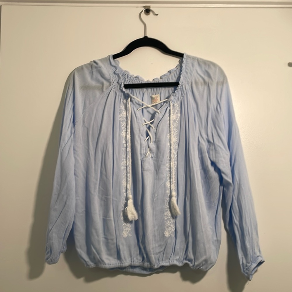 Baby blue blouse with white detailing